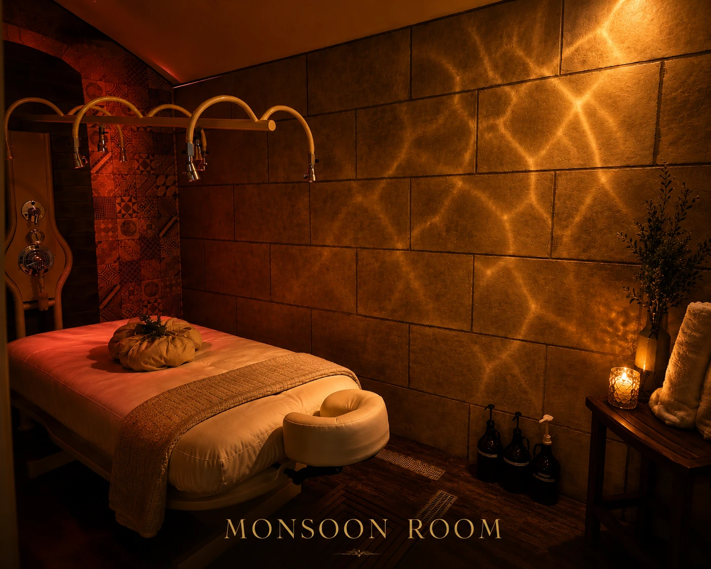 The Monsoon Room, with rain-shower arms over a treatment table